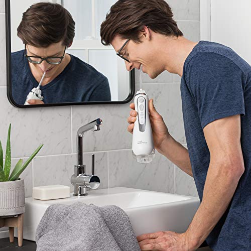Waterpik Cordless Advanced Water Flosser WP-560 - 3 Pressure Settings - 360° Tip Rotation - 45 Seconds Water Capacity - Extra Quiet Design - 4x Flosser Tips - Dental Floss - Oral Hygiene - White
