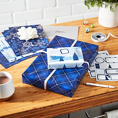 Hallmark Flat Christmas Wrapping Paper Sheets with Cutlines on Reverse and Gift Tag Seals (12 Folded Sheets, 16 Gift Tag Stickers) Blue and Silver Snowflakes, Deer Forest Scene, Blue Tartan Plaid