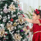 TOYANDONA 12Pcs Christmas Glitter Poinsettia Flowers, Christmas Tree Flower Decorations Artificial Flowers with Stems and Clips for Wedding Party Wreath (Champagne)